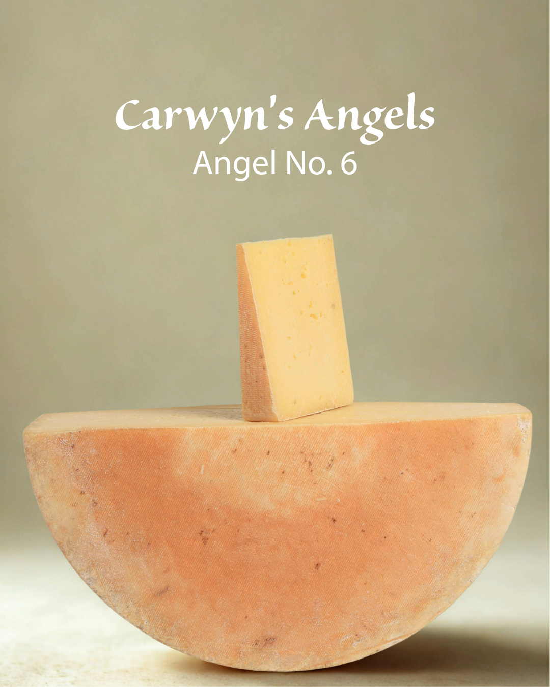 A half wheel of 'Carwyn's Angels Angel No. 6' alpine-style cheese with a wedge of cheese placed on top.